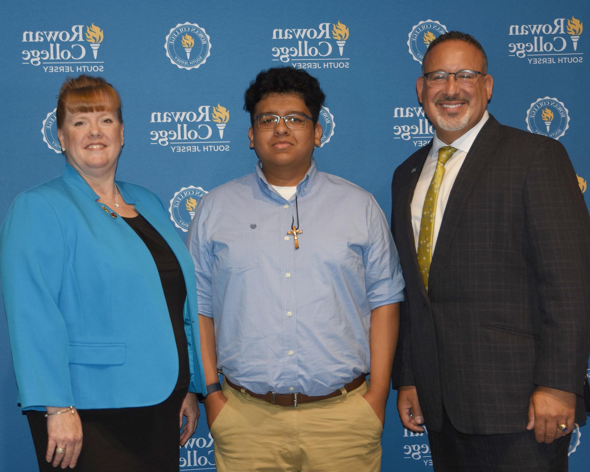 U.S. Department of Education Secretary Miguel Cardona, RCSJ graduates Jesus Calixto and Miriam Craig-Venti.